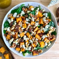 Spinach Salad with Roasted Sweet Potatoes, Dates, Walnuts, Blue Cheese, and Shallot-Sherry Vinaigrette