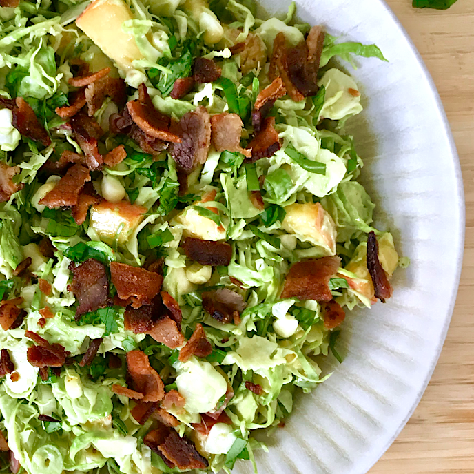 Brussels Sprout, Corn, Peach, and Bacon Slaw with Creamy Basil-Lemon Dressing